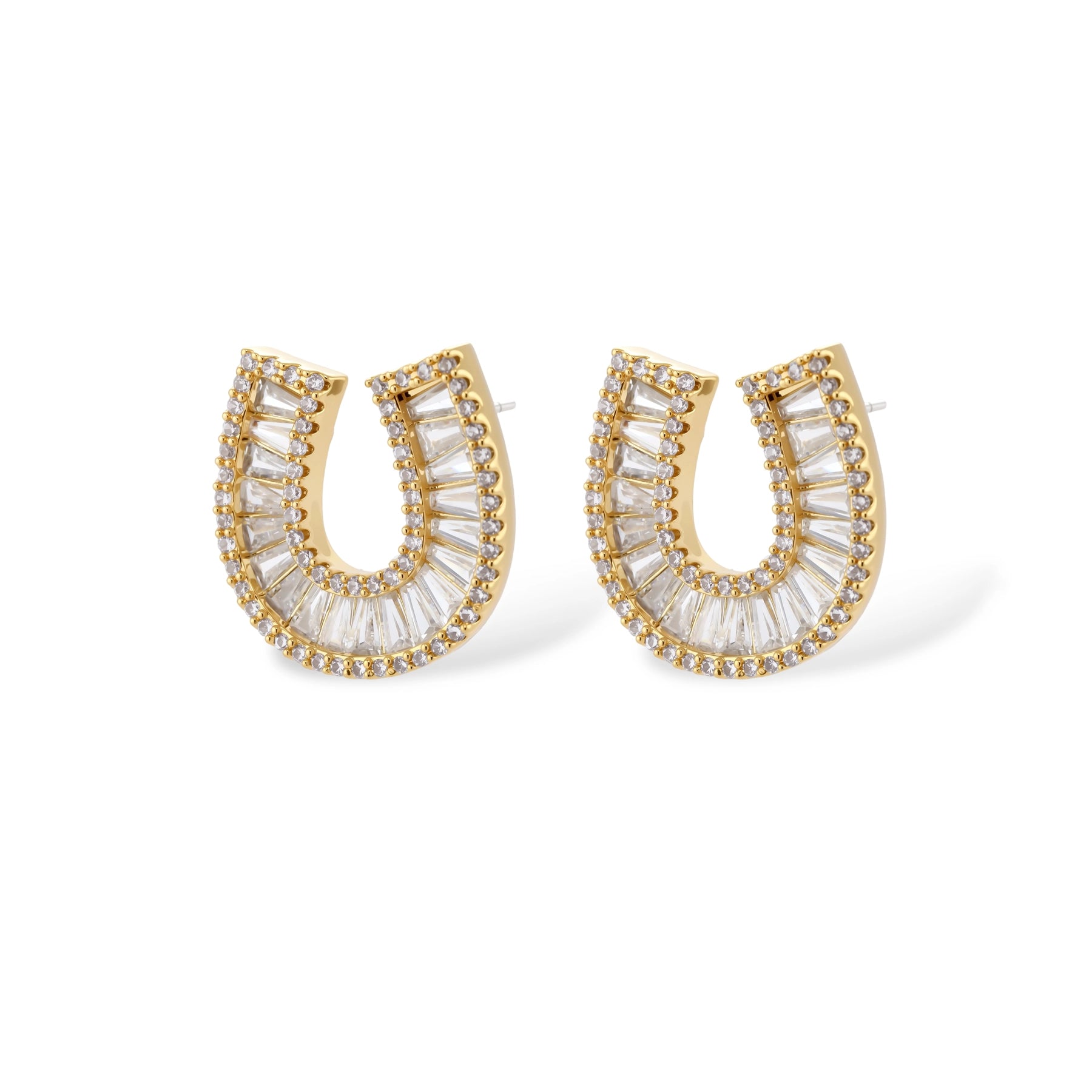 Sparkling horseshoe-shaped jewelry set with AAA cubic zirconia in gold-plated and white gold finishes on cream background.