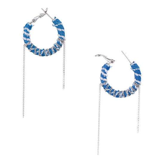 Medium hoop earrings wrapped in blue striped denim fabric with dangling silver chains on white background.