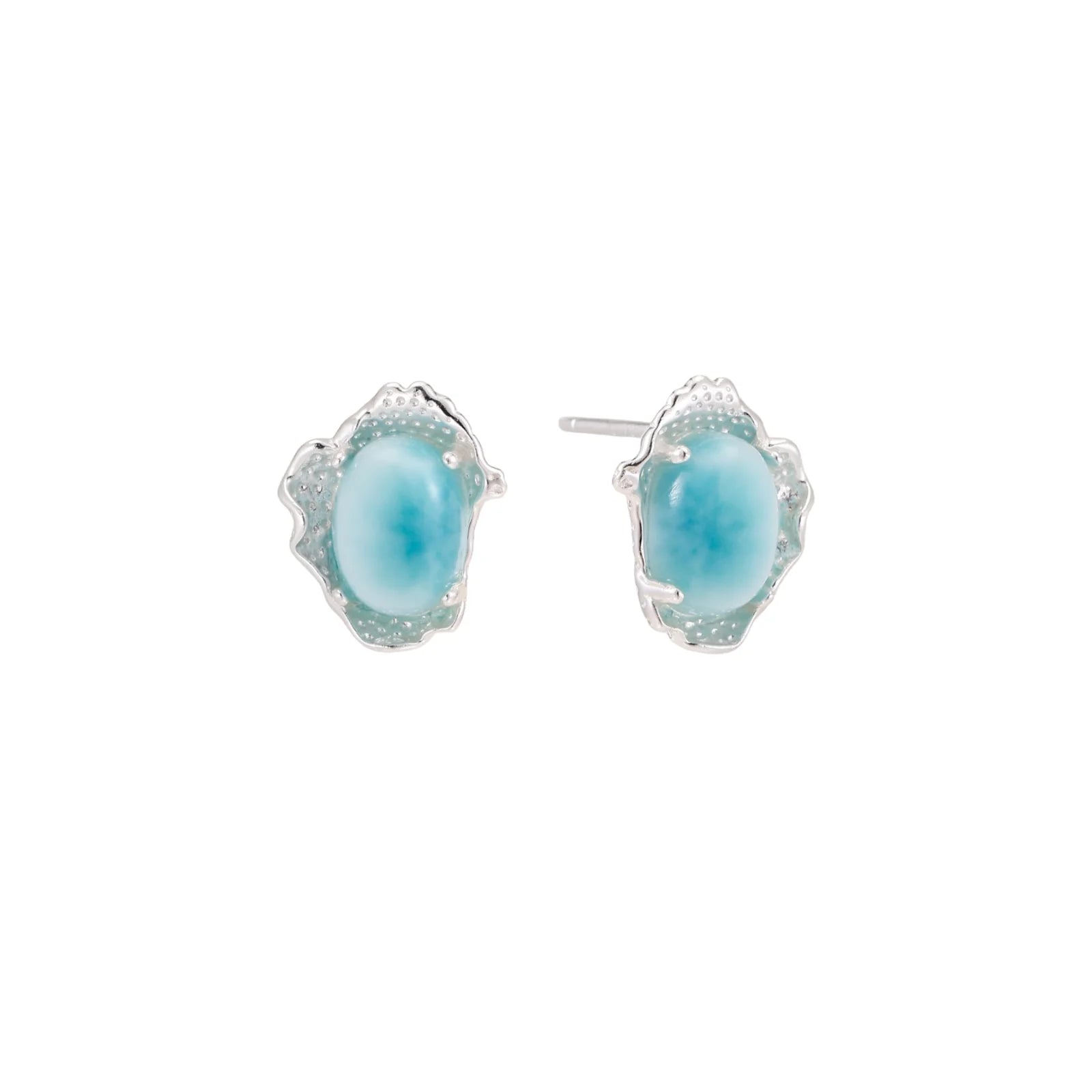 Oval larimar gemstone studs with ornate silver settings showing natural turquoise marbling on cream background