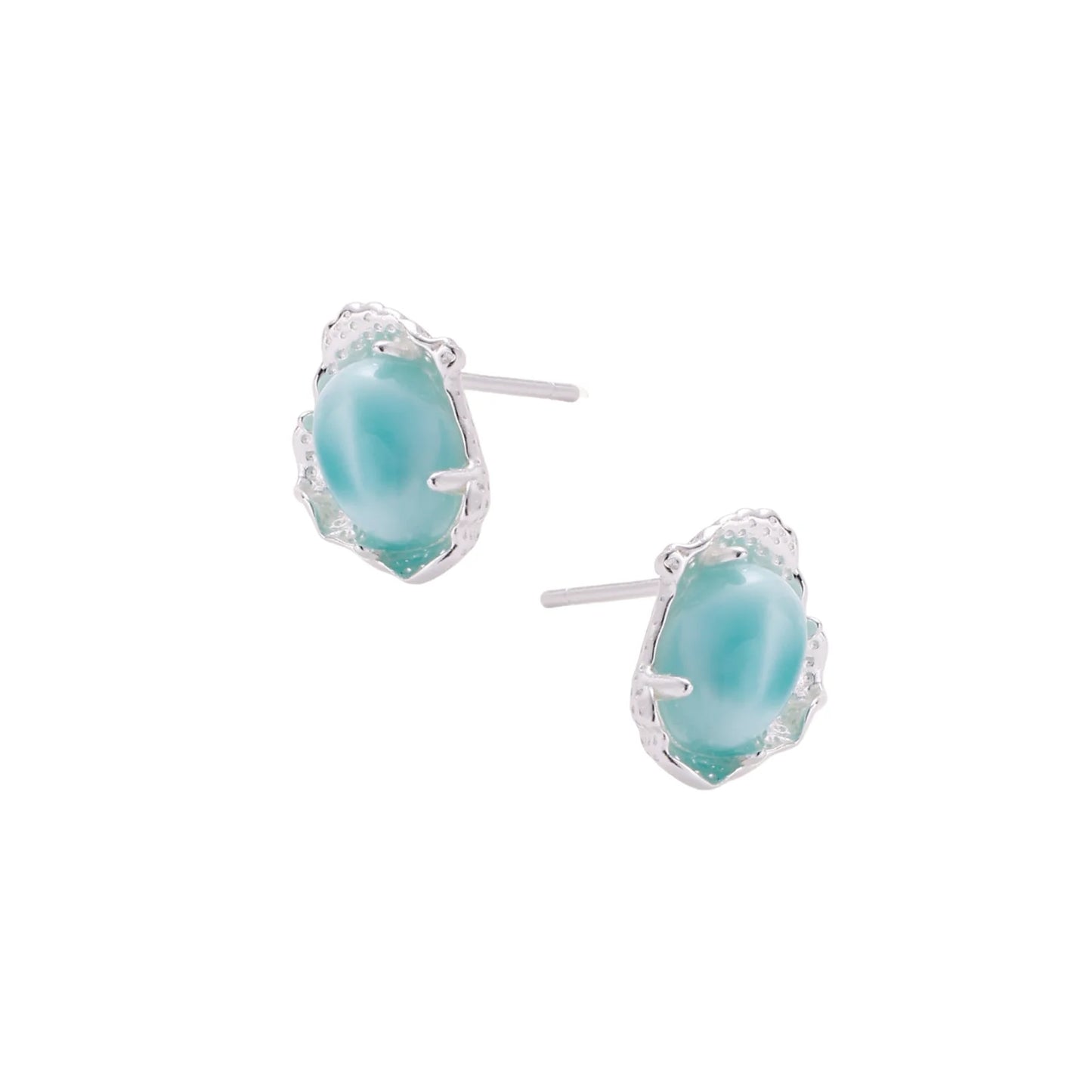 Oval larimar gemstone studs with ornate silver settings showing natural turquoise marbling on cream background