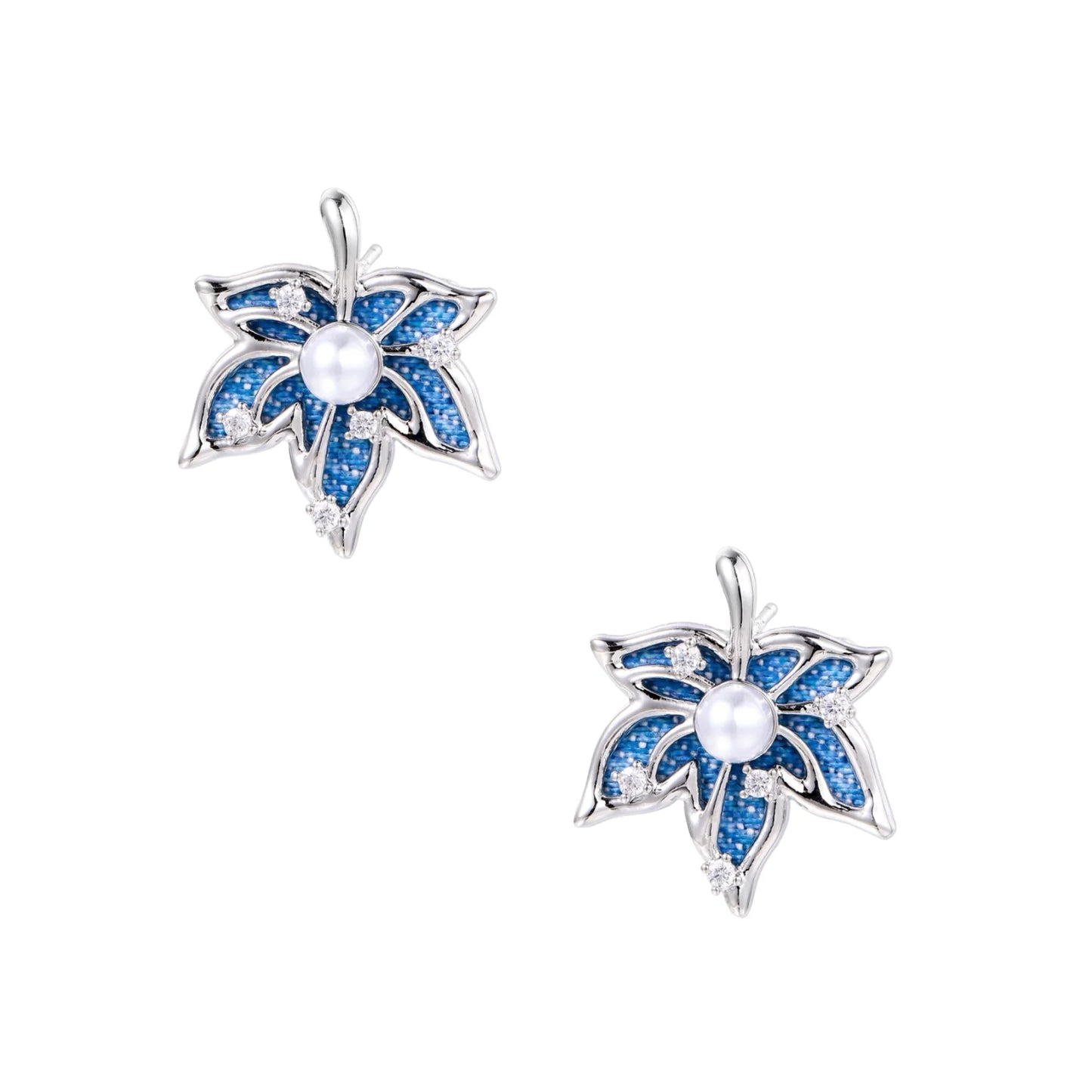 Blue denim fabric star-flower stud earrings with white pearl center and crystal accents on white gold-plated frame
