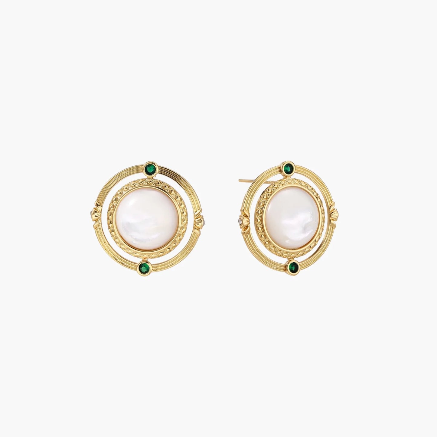 Circular gold stud earrings with iridescent mother-of-pearl center and green zirconia accents on cream background.