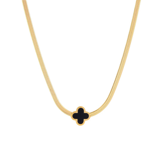 Dainty 18K gold-plated herringbone chain necklace with black enamel quatrefoil clover pendant on white background