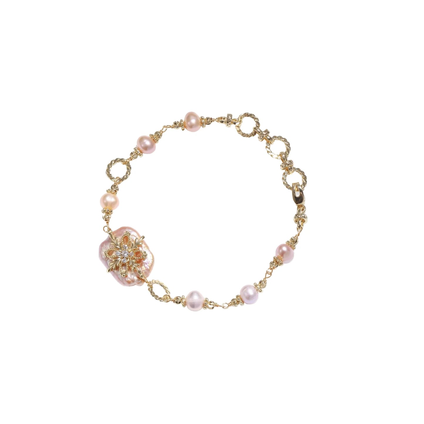 Gold-plated bracelet with pink baroque pearl centerpiece, floral connector, and freshwater pearls