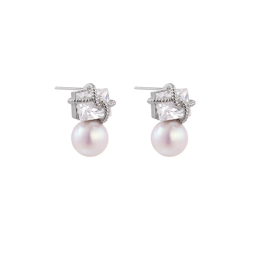 White gold stud earrings with square crystal stones in twisted frames and pink freshwater pearl drops below