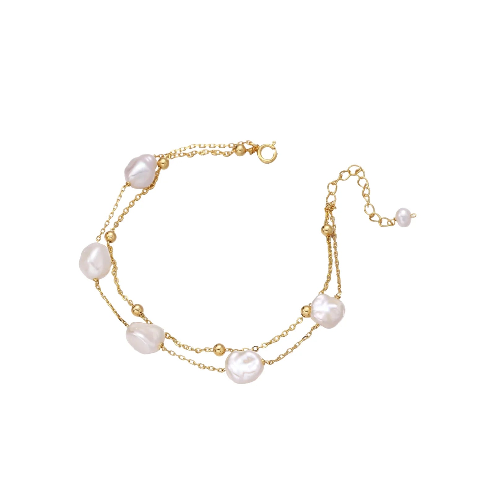 Double-strand gold bracelet with irregular baroque pearls and smooth freshwater pearls on cream background.