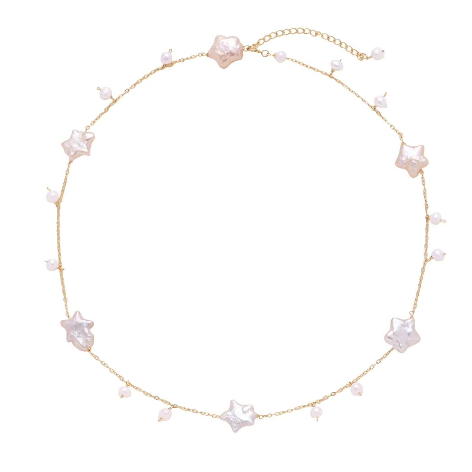 Gold vermeil chain with iridescent star-shaped baroque pearls and small round freshwater pearl drops on cream background.