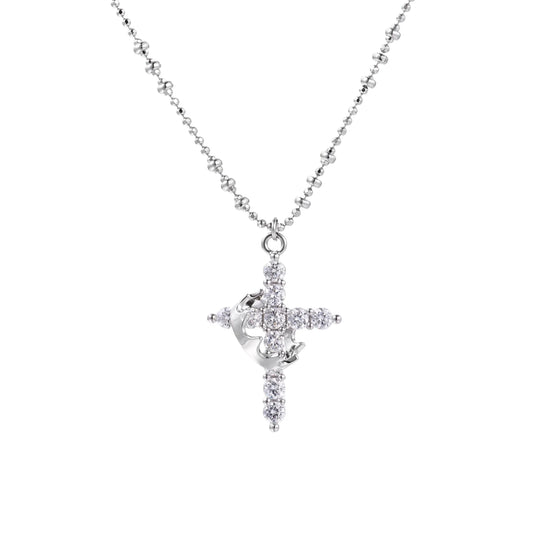 White gold-plated cross pendant adorned with sparkling zirconia stones and crescent moon accent on ball chain
