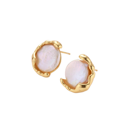 Gold vermeil studs with lustrous pink freshwater pearls in organic crescent settings
