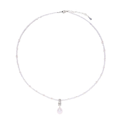 Dainty necklace with lavender crystal beads, freshwater pearls, geometric pendant, and large pearl drop on white background.