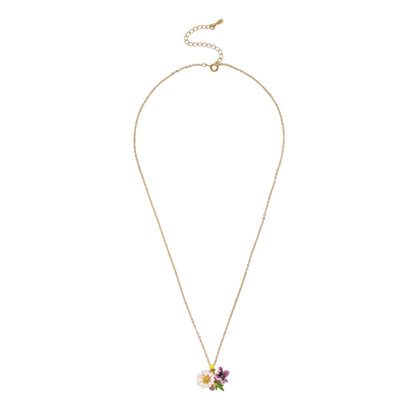 Gold-plated necklace with pink and purple enamel flower pendant featuring crystal accents on cream background