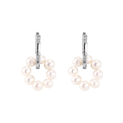 Rhodium-plated silver hoop earrings with freshwater pearls arranged in crescent formation and diamond accents