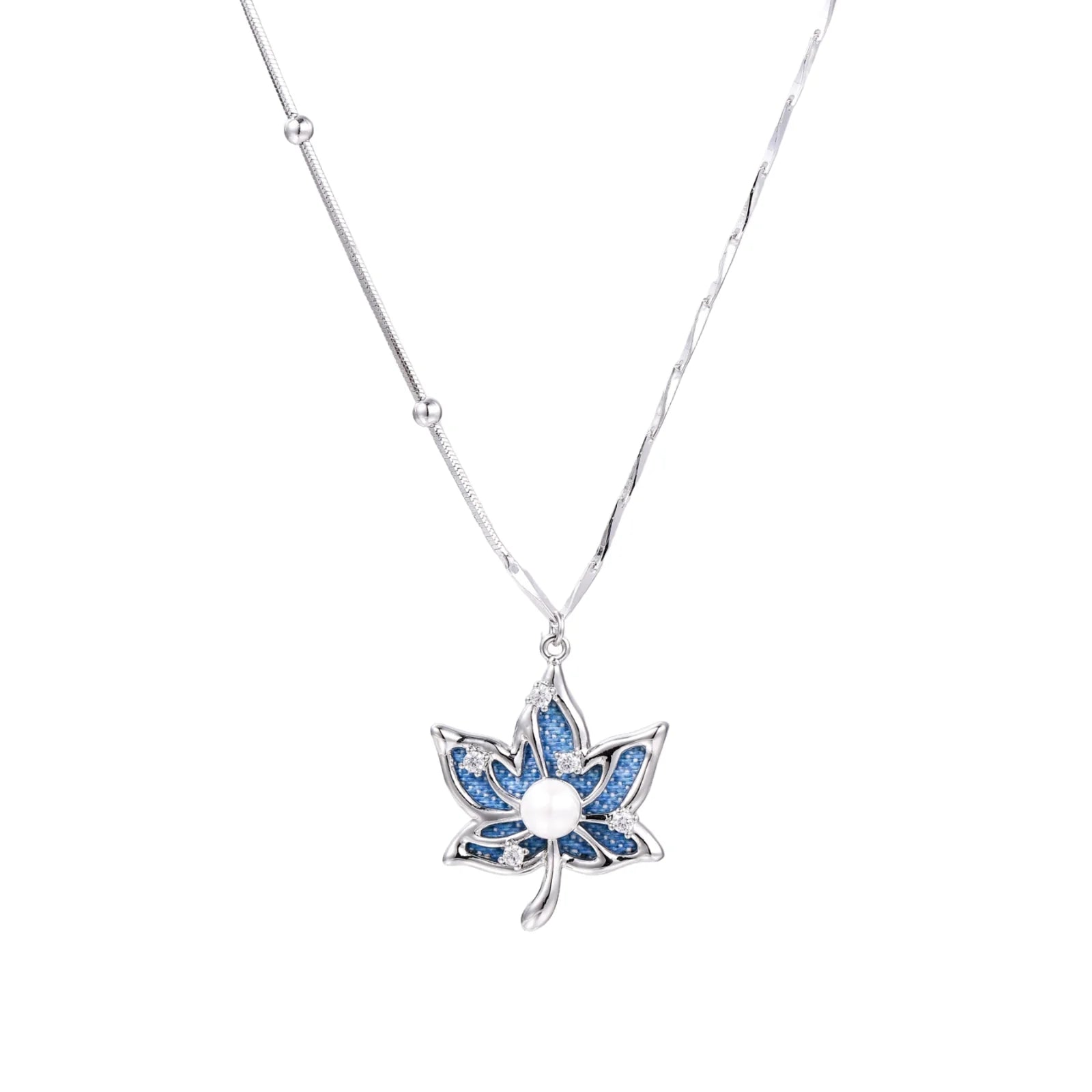 White gold-plated lotus pendant with blue denim fabric inlay and sparkling zirconia stones on adjustable chain