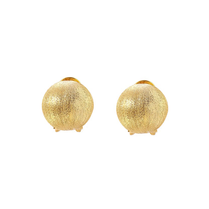 Pair of brushed gold dome earrings with clip backs showing textured matte finish on cream background