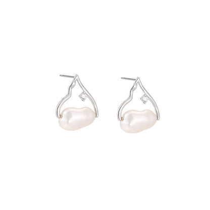 Silver mountain outline studs with baroque pearl and diamond accent on white background