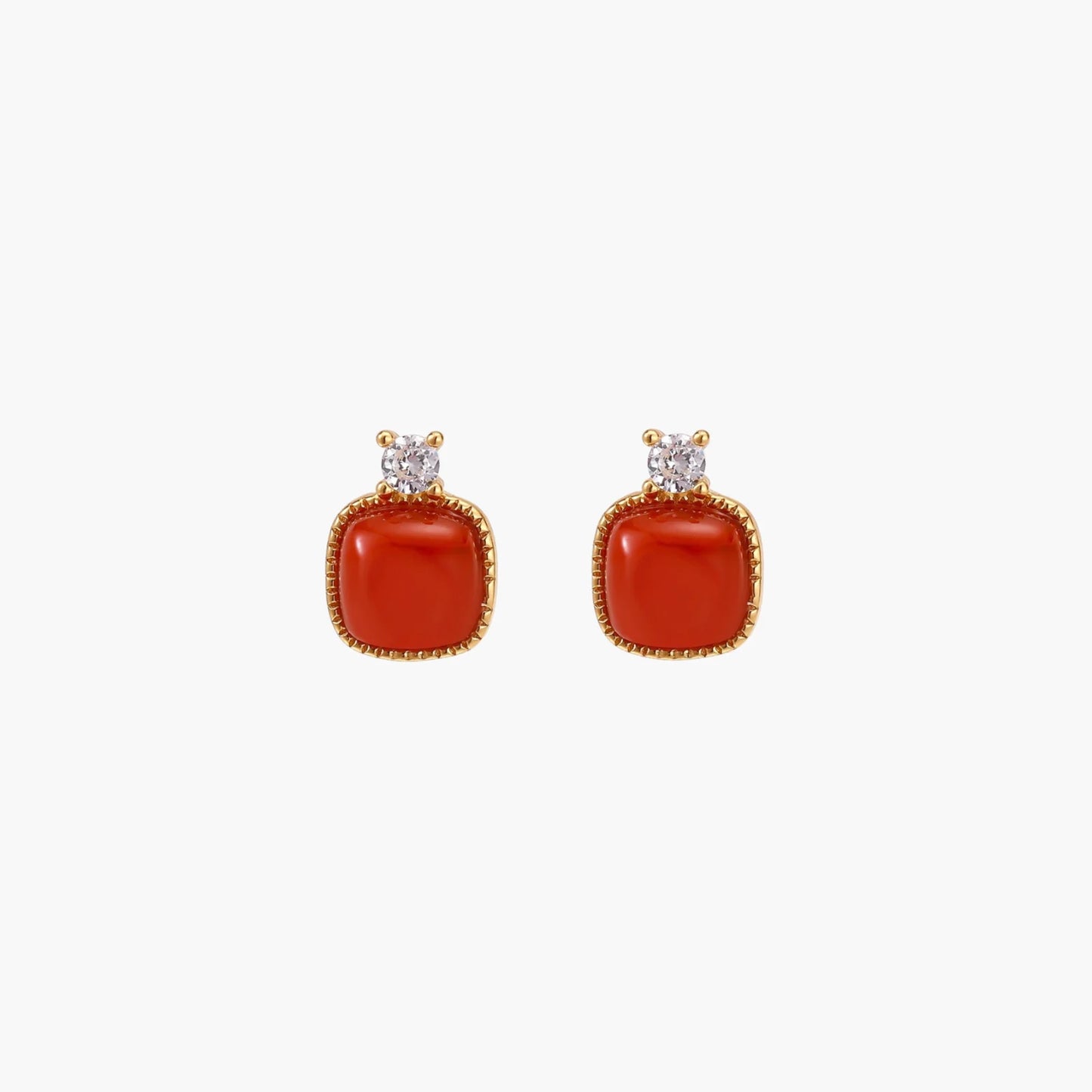 18K gold vermeil stud earrings with cushion-cut red agate stones and sparkling crystal accents on beige background