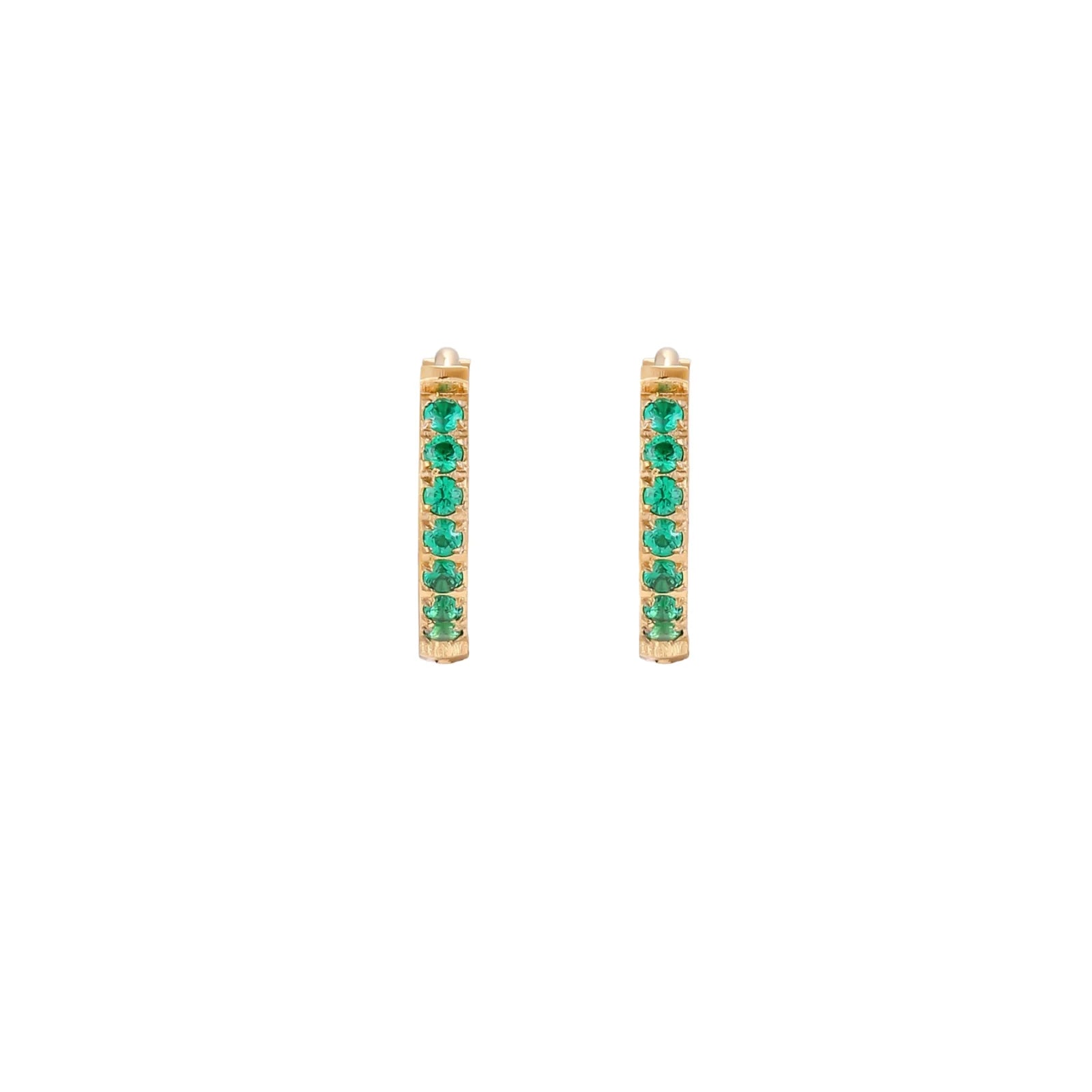 Pair of small gold huggie hoop earrings with bright green cubic zirconia stones on cream background