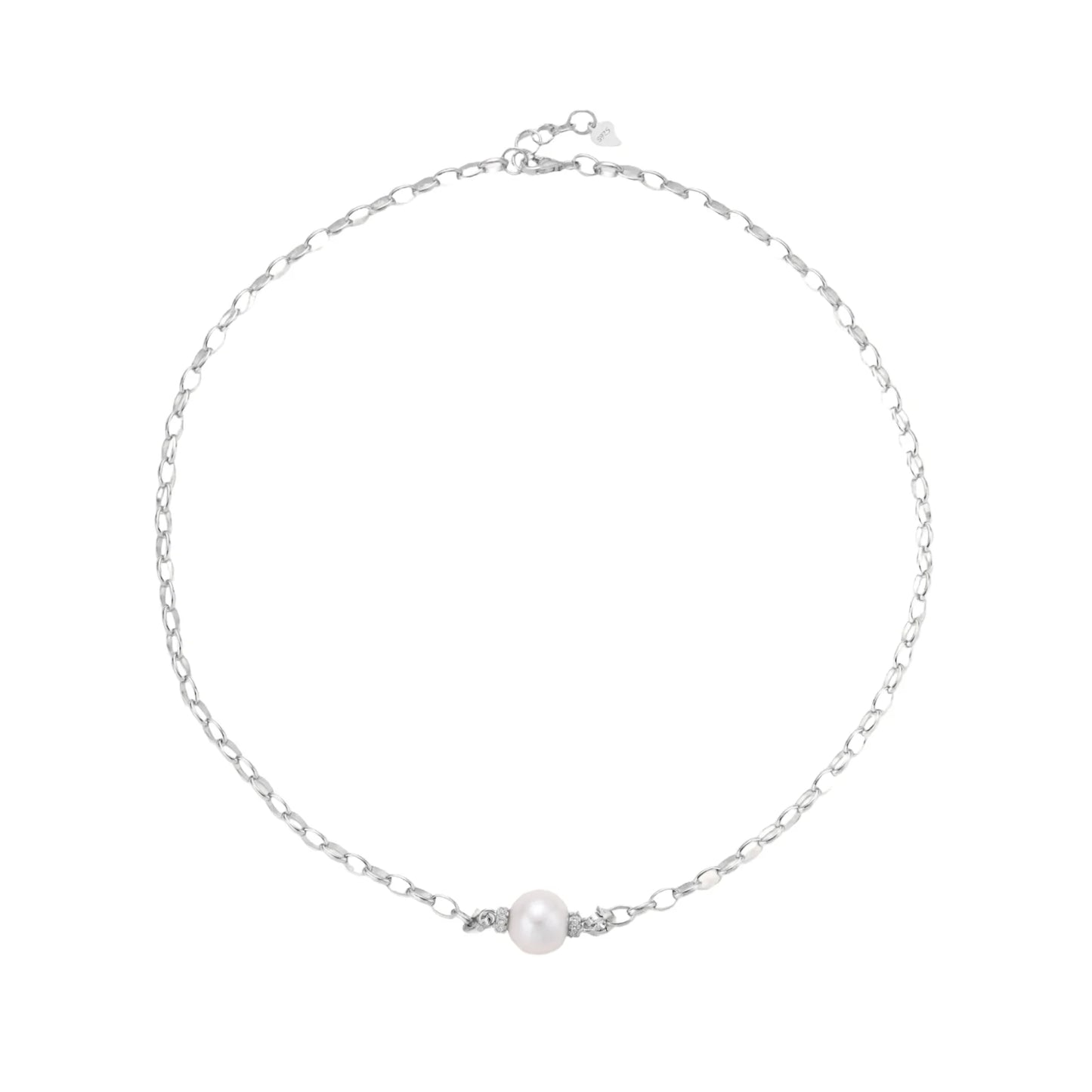 Dainty rhodium-plated silver chain necklace with centered 10mm freshwater pearl and crystal accents on cream background