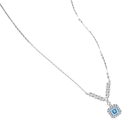 Sterling silver necklace with geometric crystal arrangement forming a V-shape and square blue moissanite centerpiece pendant
