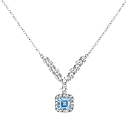 Sterling silver necklace with geometric crystal arrangement forming a V-shape and square blue moissanite centerpiece pendant