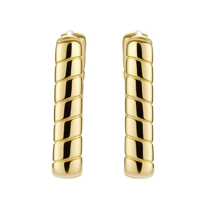 Chunky segmented gold-plated huggie hoop earrings with bamboo-inspired geometric design on white background.