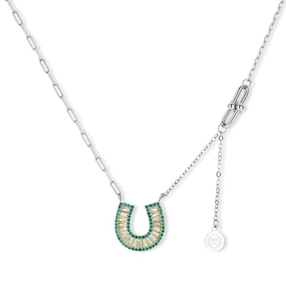 Sparkling horseshoe-shaped jewelry set with AAA cubic zirconia in gold-plated and white gold finishes on cream background.