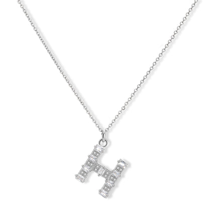 Letter H jewelry set featuring geometric crystal design in gold and white gold plated finish with adjustable chain necklace