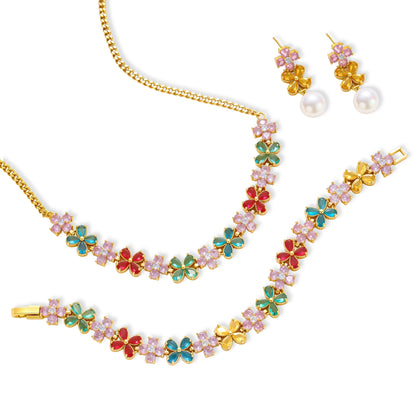 Gold-plated jewelry set with pink, turquoise and red flower-shaped cubic zirconia stones, featuring necklace, earrings and bracelet.