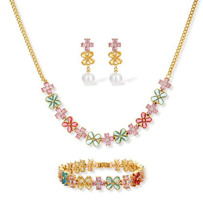Gold-plated jewelry set with pink, turquoise and red flower-shaped cubic zirconia stones, featuring necklace, earrings and bracelet.